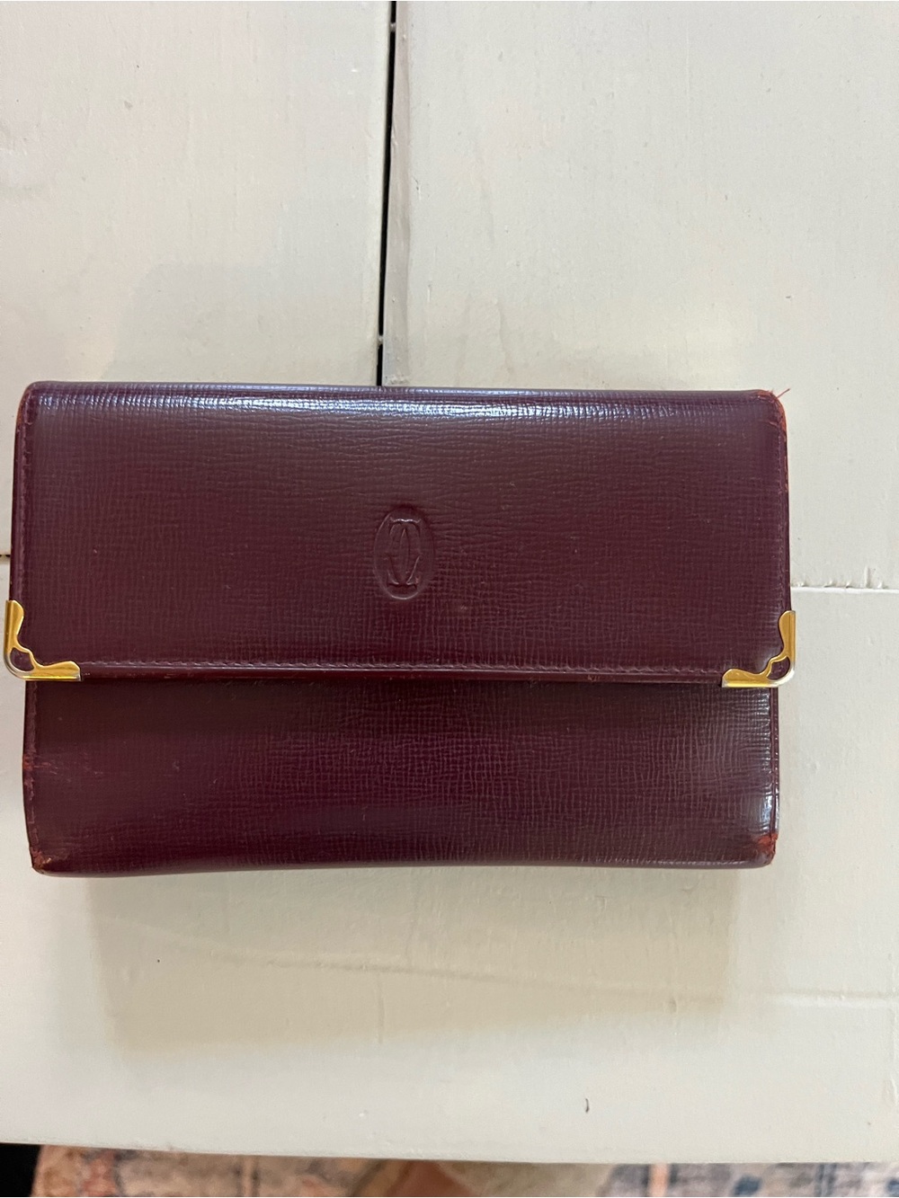Cartier Burgundy Leather Wallet with Gold Corner Details